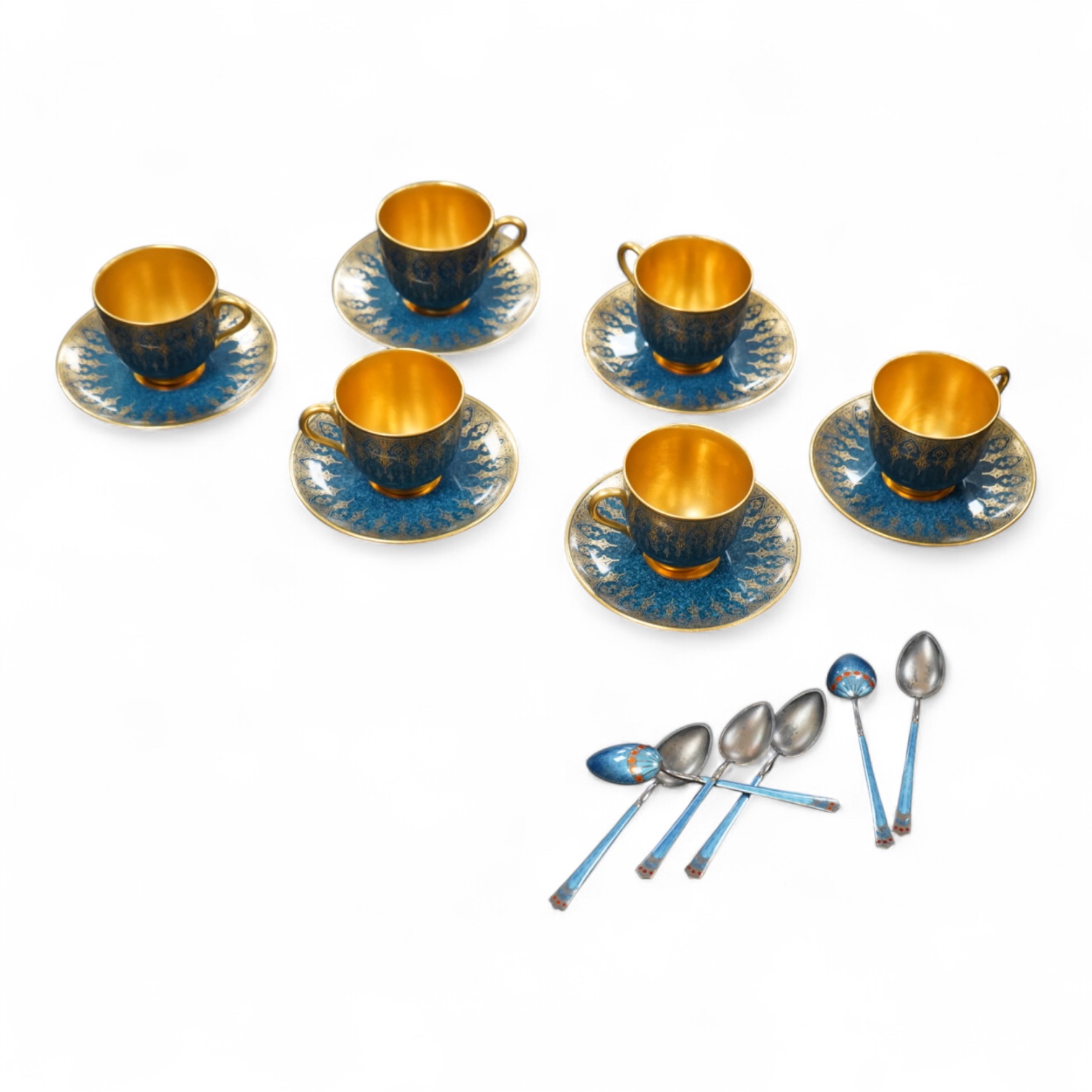 A set of six Royal Worcester cups and saucers, powder blue and gilt decoration, together with a set of six silver and enamel teaspoons